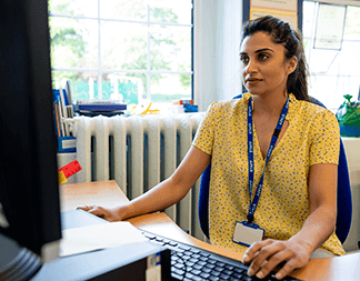 Teacher using computer